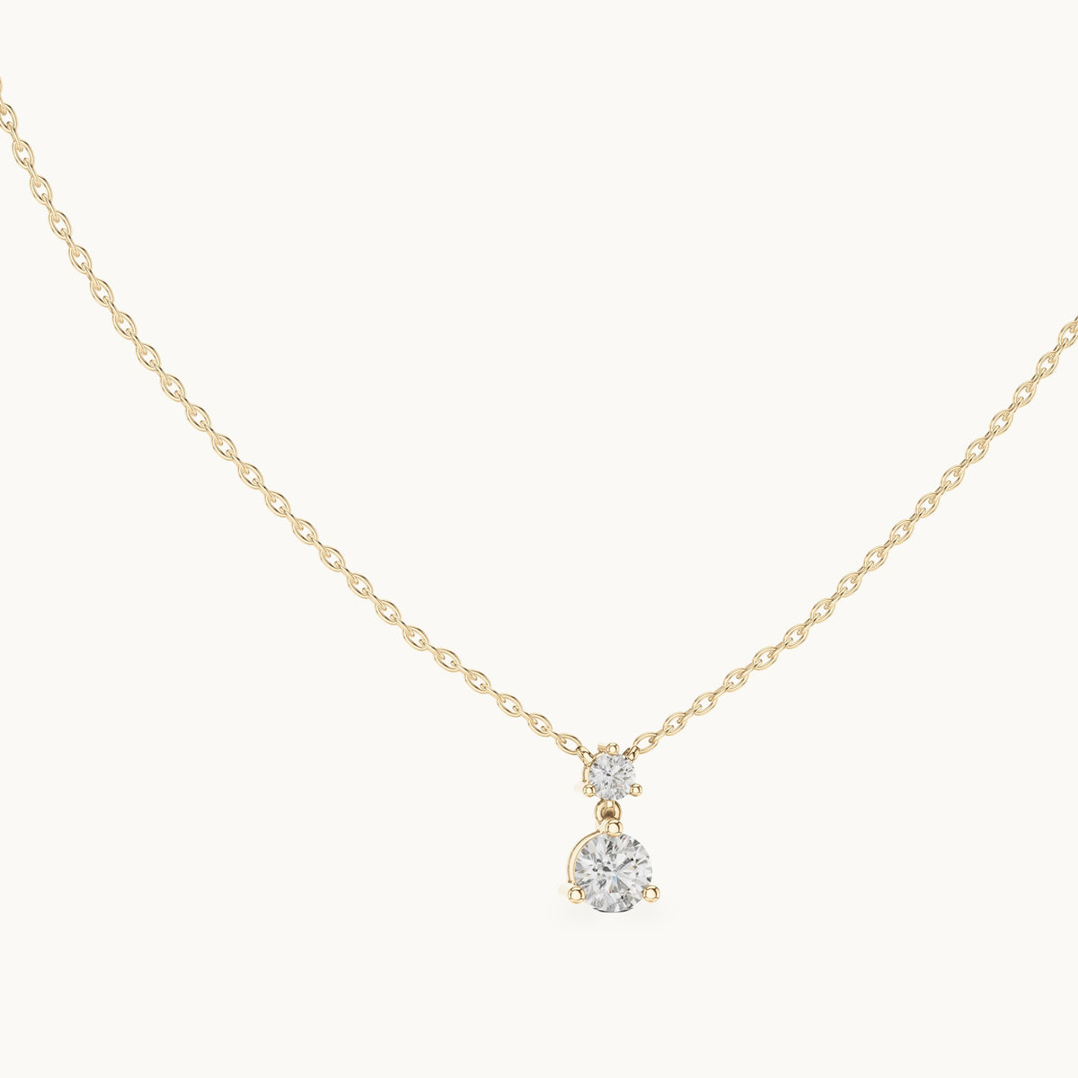 Round lab-grown diamond two-stone drop pendant in yellow gold, 0.61 CT TW, view 1