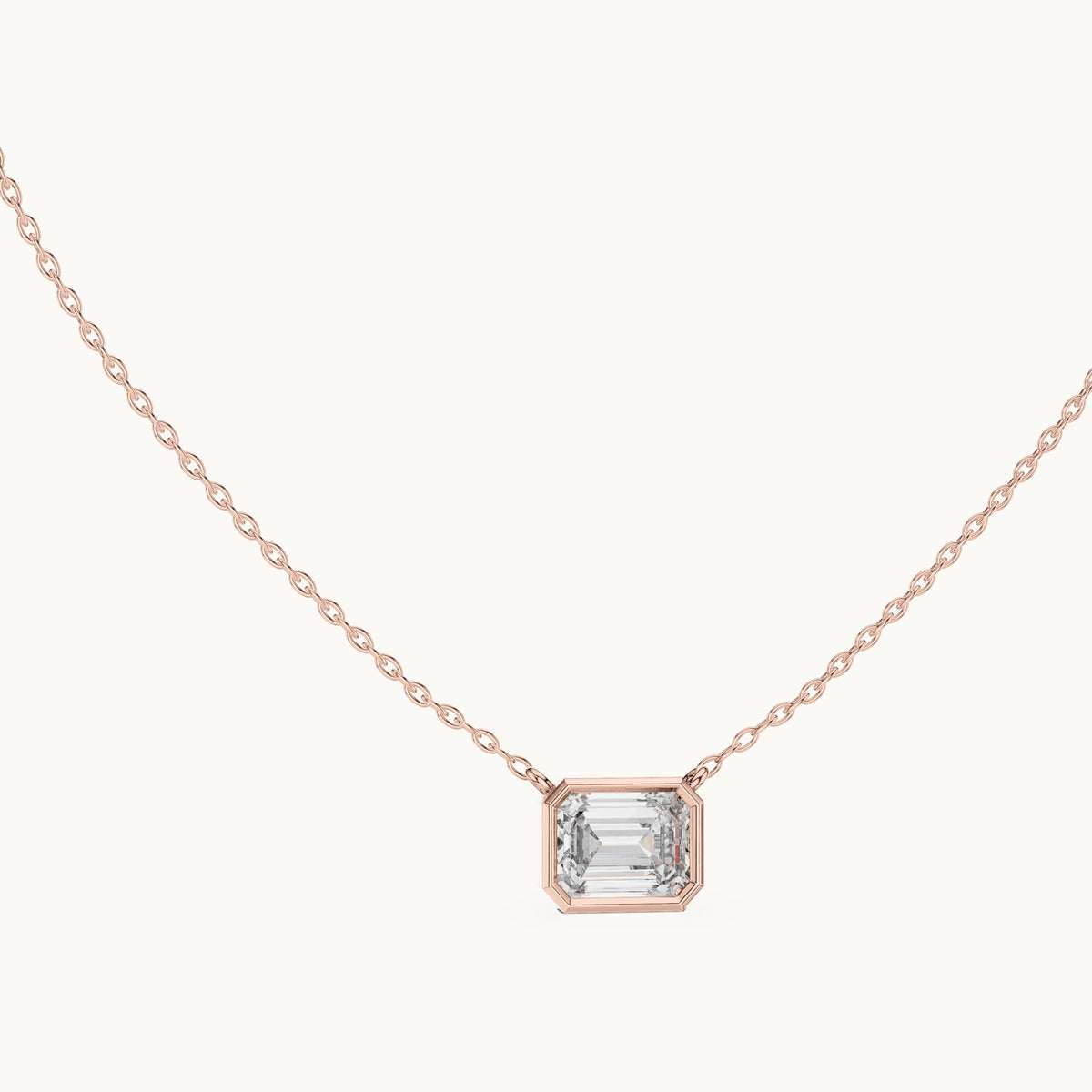 Emerald-cut lab-grown diamond east-west bezel solitaire pendant in rose gold, 2.50 CT TW, view 1