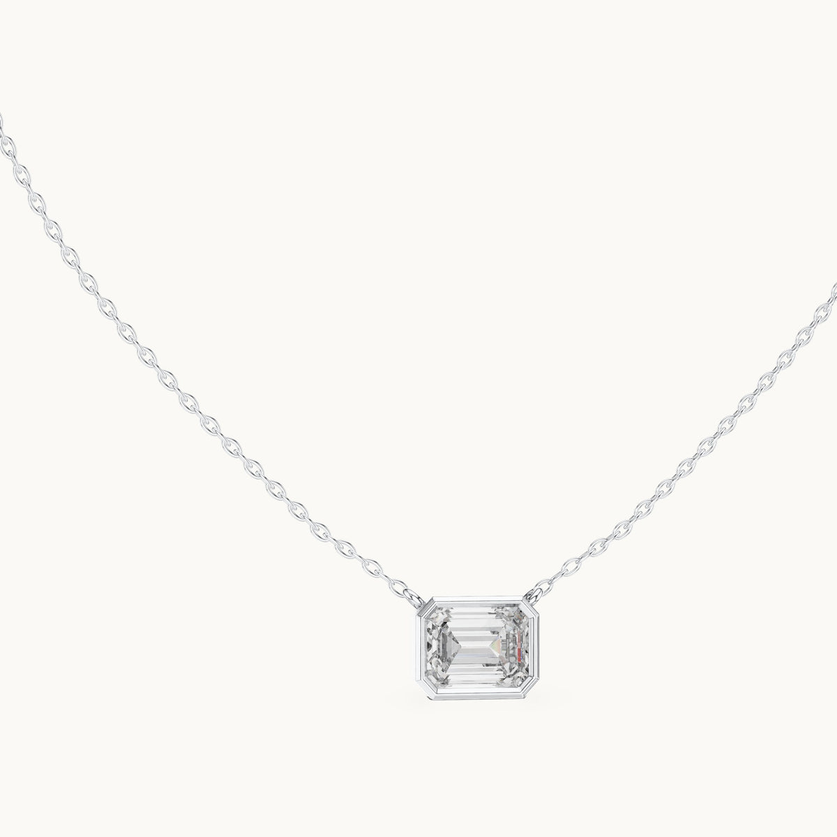 Emerald-cut lab-grown diamond east-west bezel solitaire pendant in white gold, 2.50 CT TW, view 1