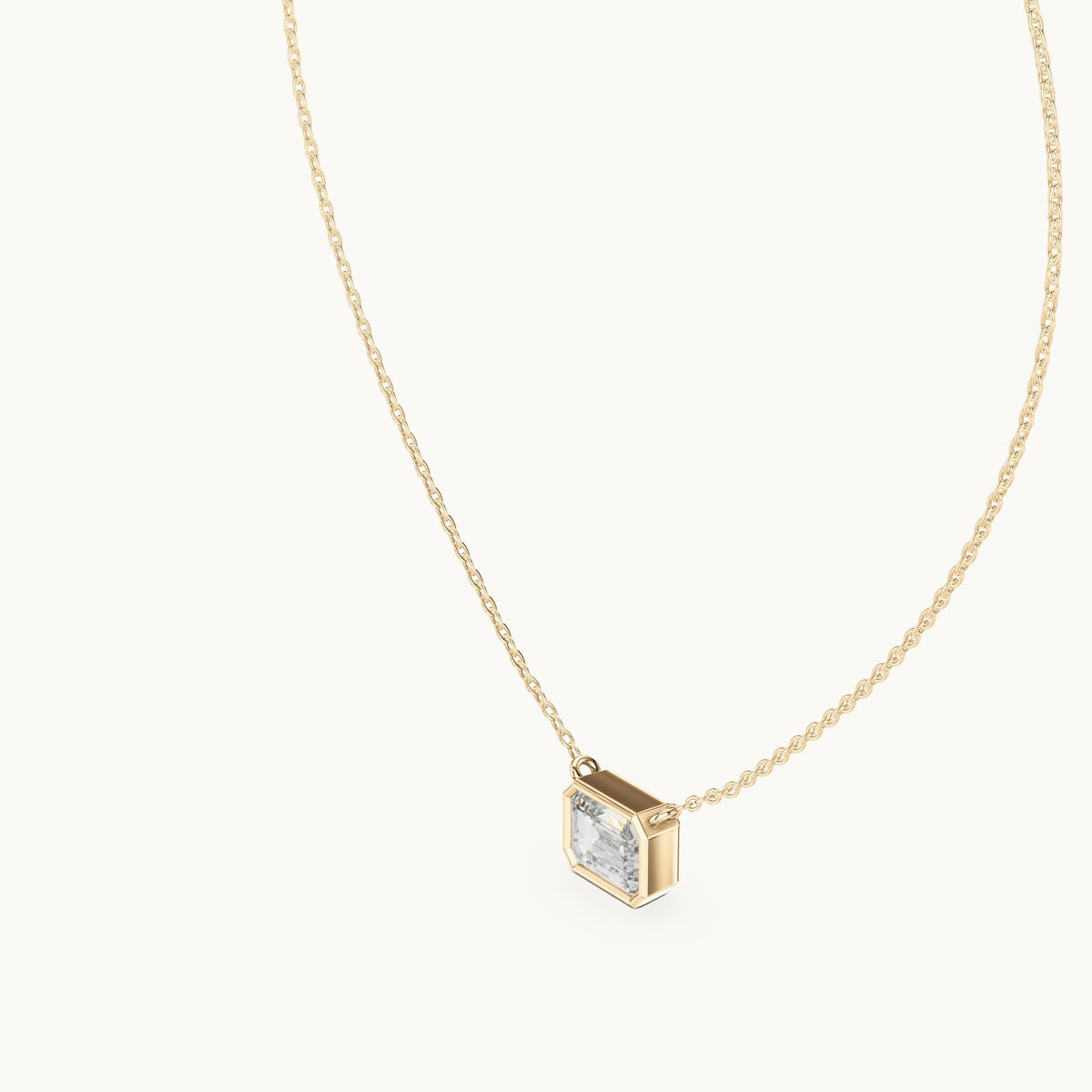 Emerald-cut lab-grown diamond east-west bezel solitaire pendant in yellow gold, 2.50 CT TW, view 2