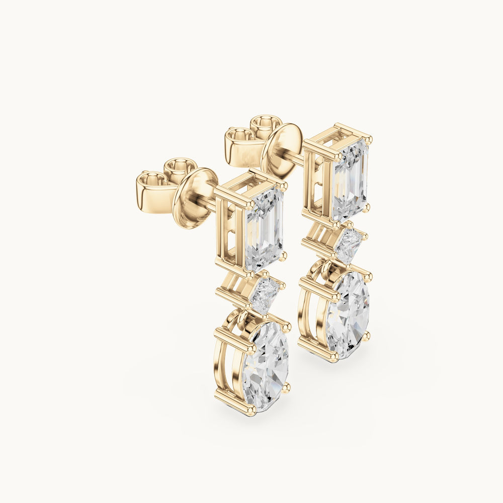Oval, emerald-cut and princess-cut lab-grown diamond linear drop earrings in yellow gold, 3.12 CT TW, view 1
