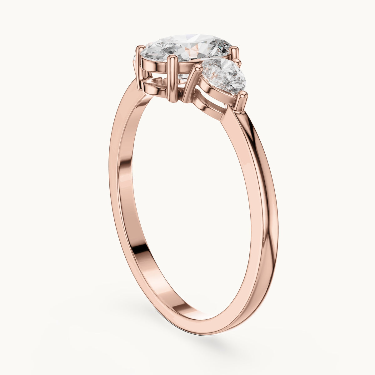 Oval lab-grown diamond three-stone engagement ring with pear side stones in rose gold, 0.93 CT TW, view 1