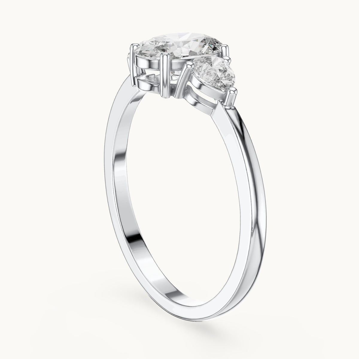 Oval lab-grown diamond three-stone engagement ring with pear side stones in white gold, 0.93 CT TW, view 1