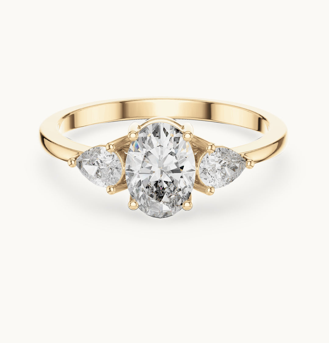 Oval lab-grown diamond three-stone engagement ring with pear side stones in yellow gold, 0.93 CT TW, view 4