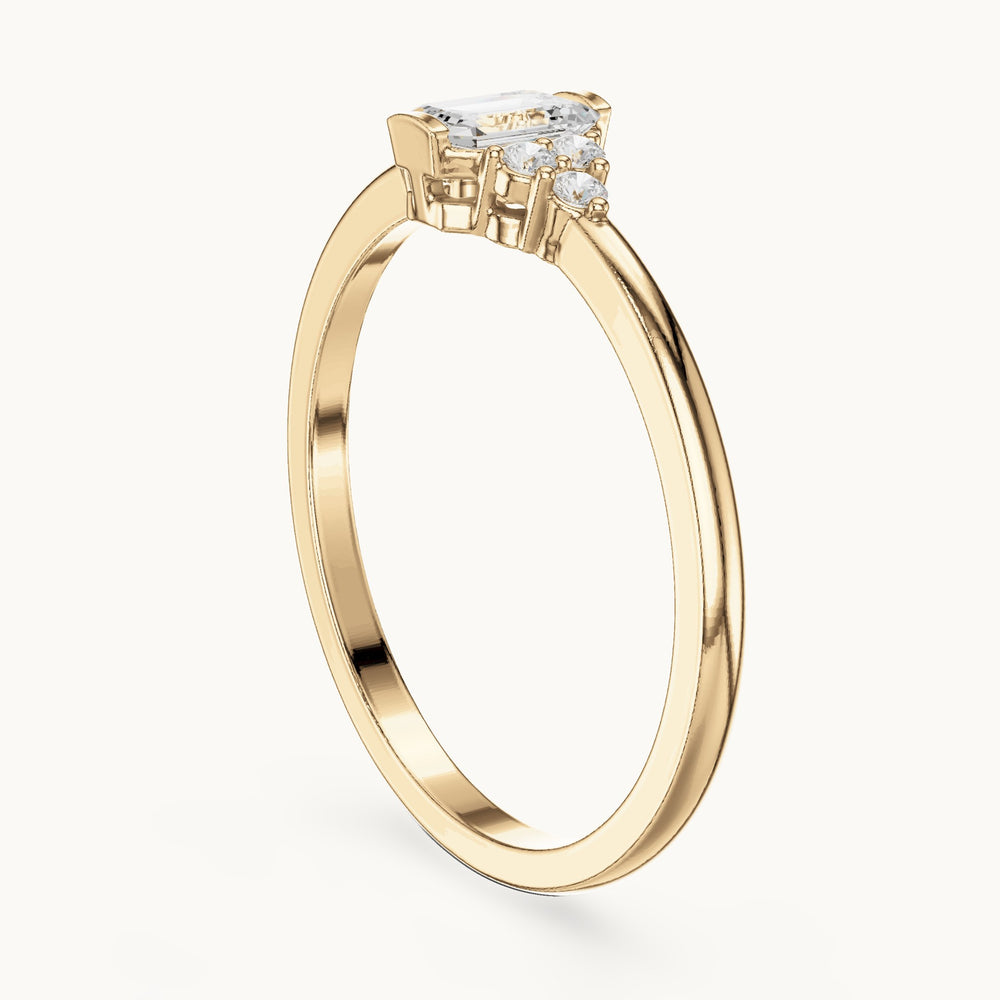 Emerald-cut lab-grown diamond engagement ring with cluster accents in yellow gold, 0.29 CT TW, view 1