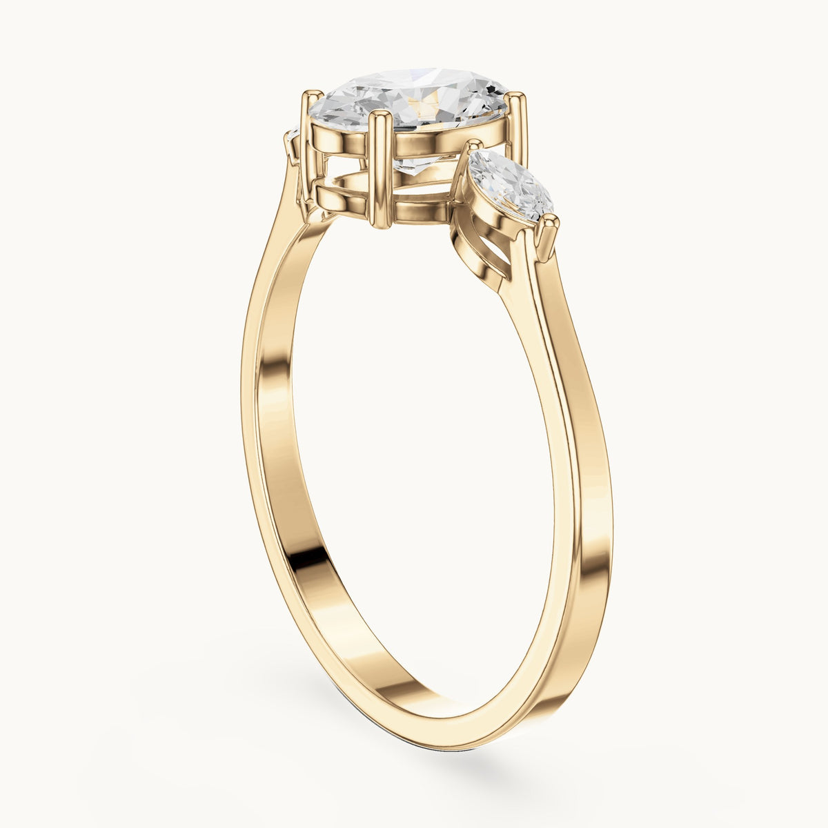 Oval lab-grown diamond three-stone engagement ring with marquise side stones in yellow gold, 0.76 CT TW, view 1