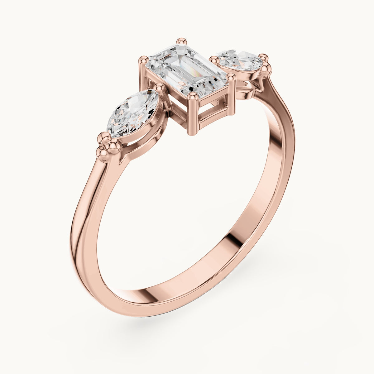 Emerald and marquise lab-grown diamond three-stone engagement ring with side stones in rose gold, 0.55 CT TW, view 2