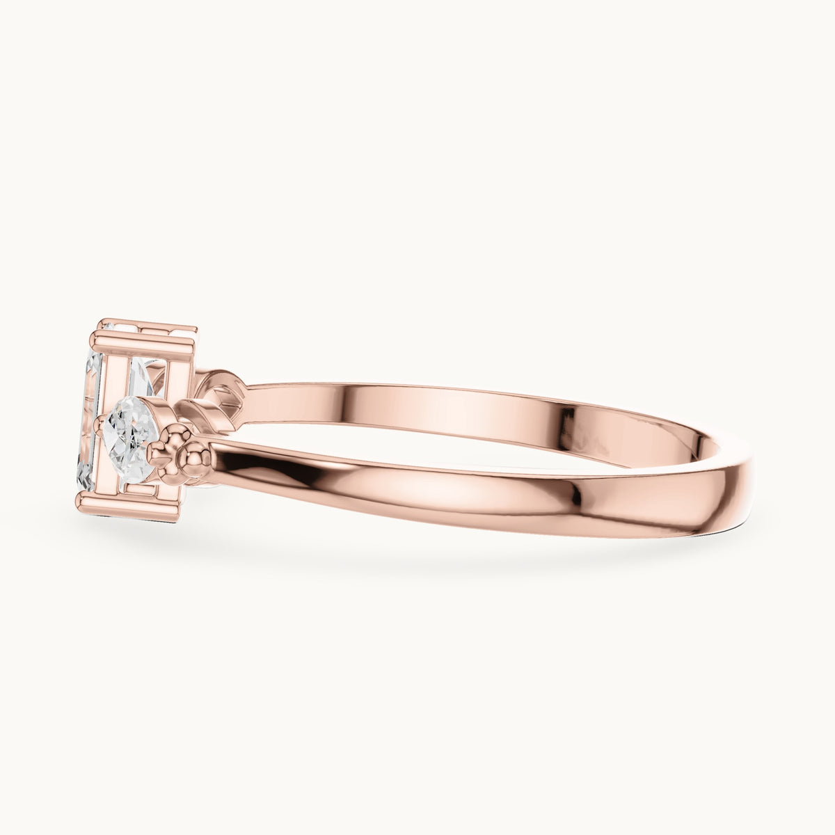 Emerald and marquise lab-grown diamond three-stone engagement ring with side stones in rose gold, 0.55 CT TW, view 3