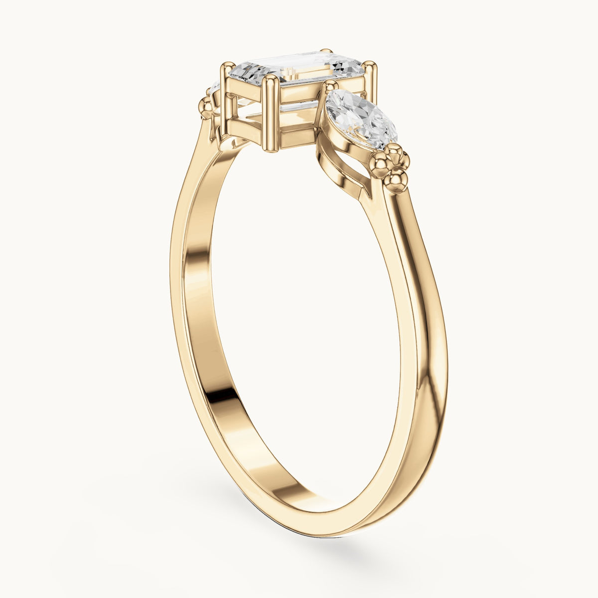 Emerald and marquise lab-grown diamond three-stone engagement ring with side stones in yellow gold, 0.55 CT TW, view 1