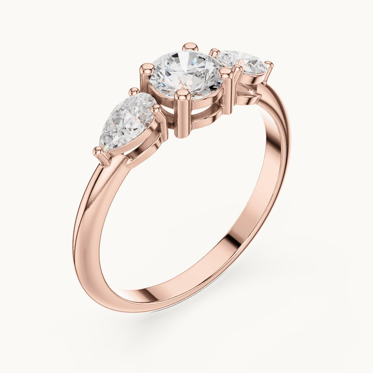Round and pear lab-grown diamond three-stone engagement ring with side stones in rose gold, 0.81 CT TW, view 2