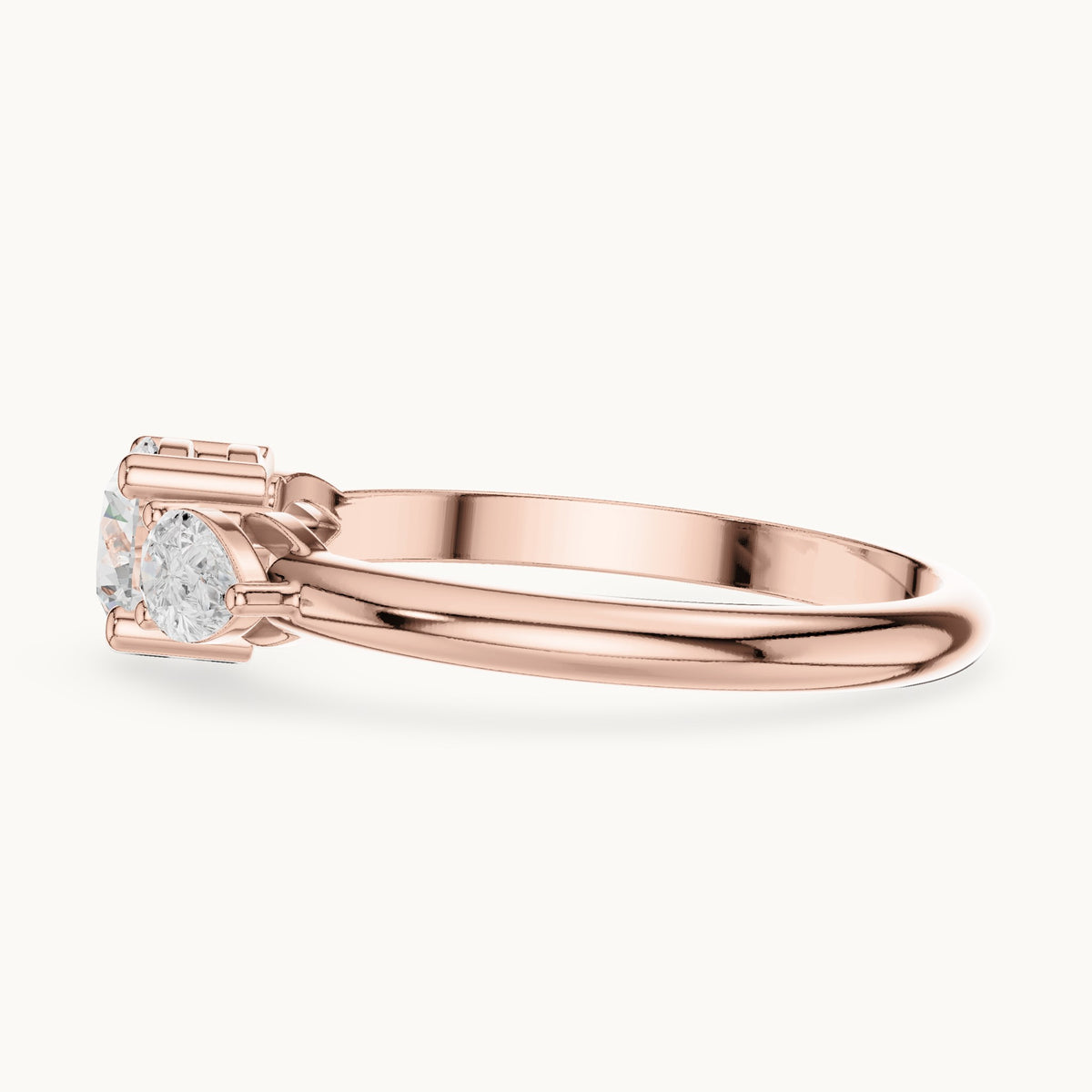 Round and pear lab-grown diamond three-stone engagement ring with side stones in rose gold, 0.81 CT TW, view 3