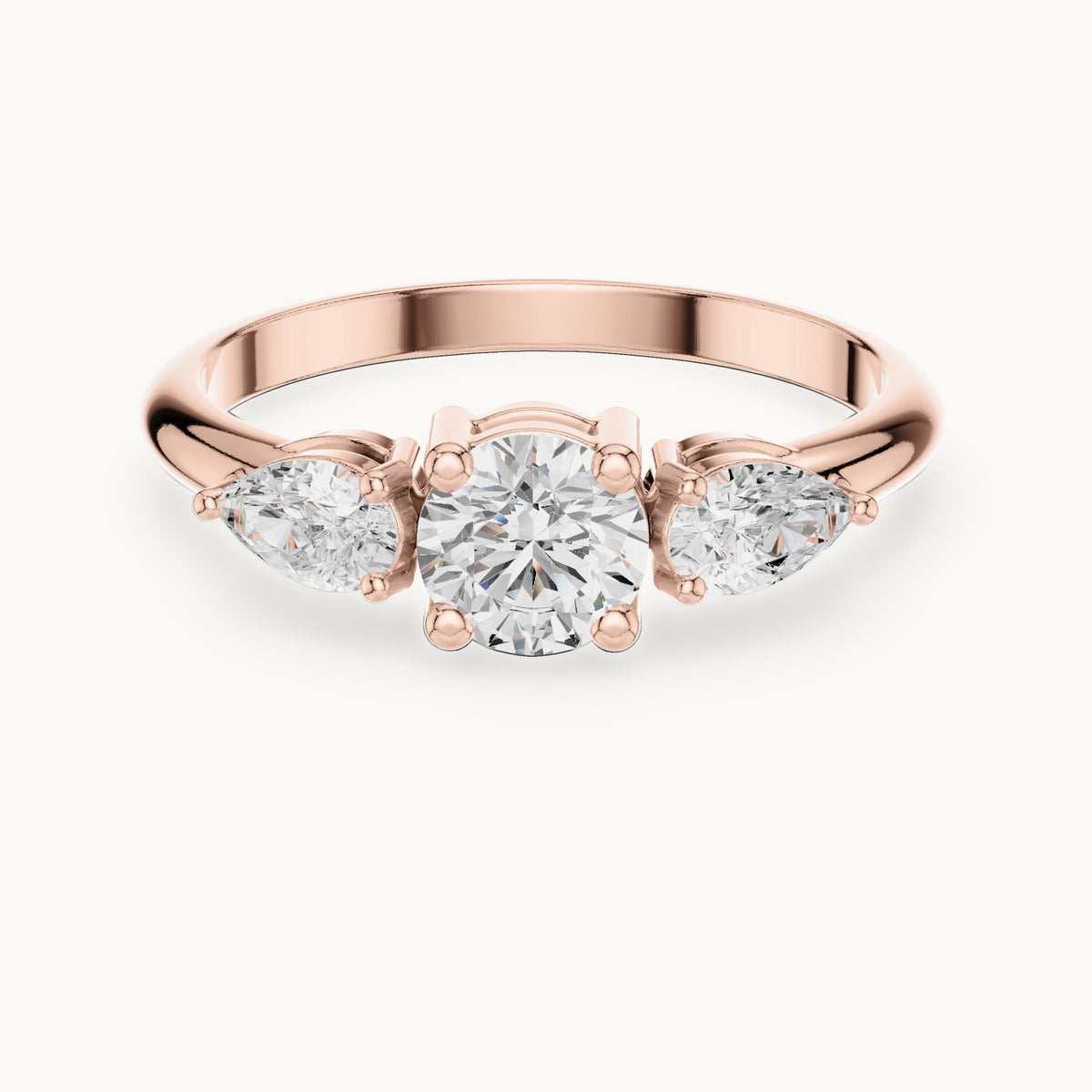 Round and pear lab-grown diamond three-stone engagement ring with side stones in rose gold, 0.81 CT TW, view 4