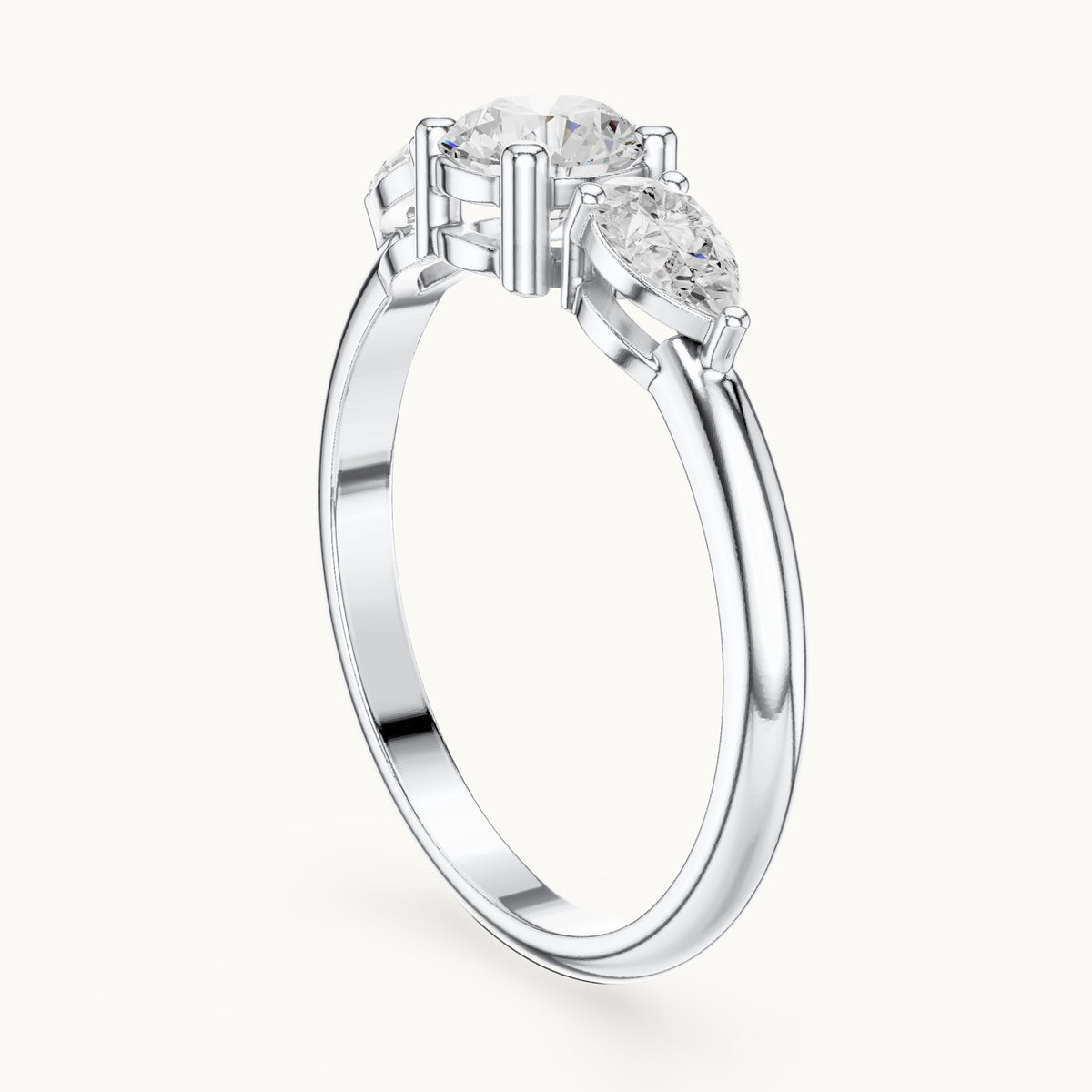 Round and pear lab-grown diamond three-stone engagement ring with side stones in white gold, 0.81 CT TW, view 1