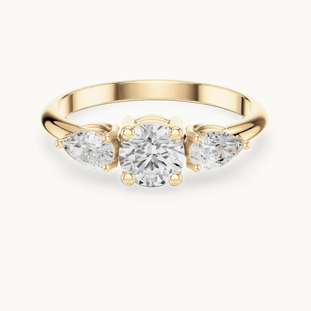 Round and pear lab-grown diamond three-stone engagement ring with side stones in yellow gold, 0.81 CT TW, view 4