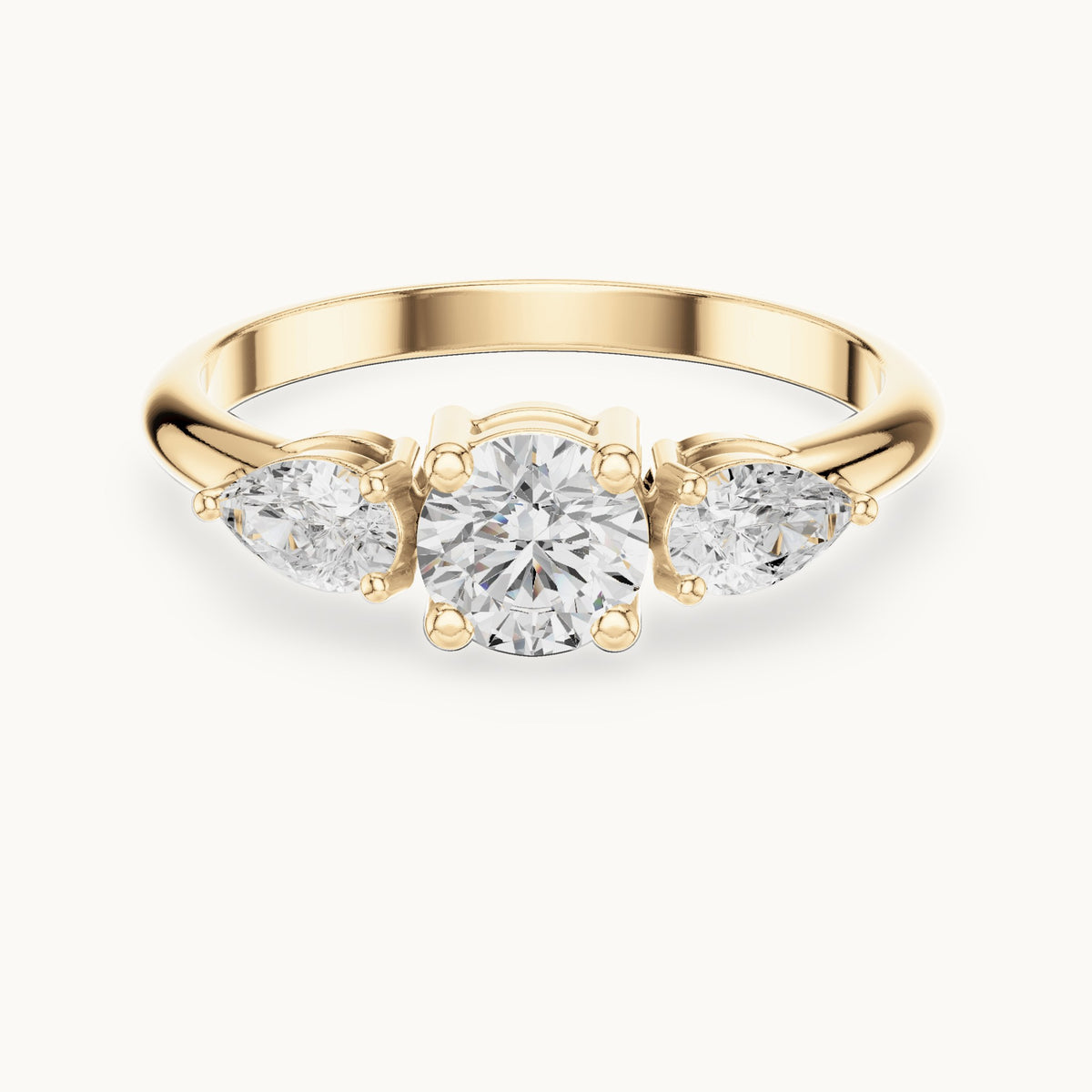 Round and pear lab-grown diamond three-stone engagement ring with side stones in yellow gold, 0.81 CT TW, view 4