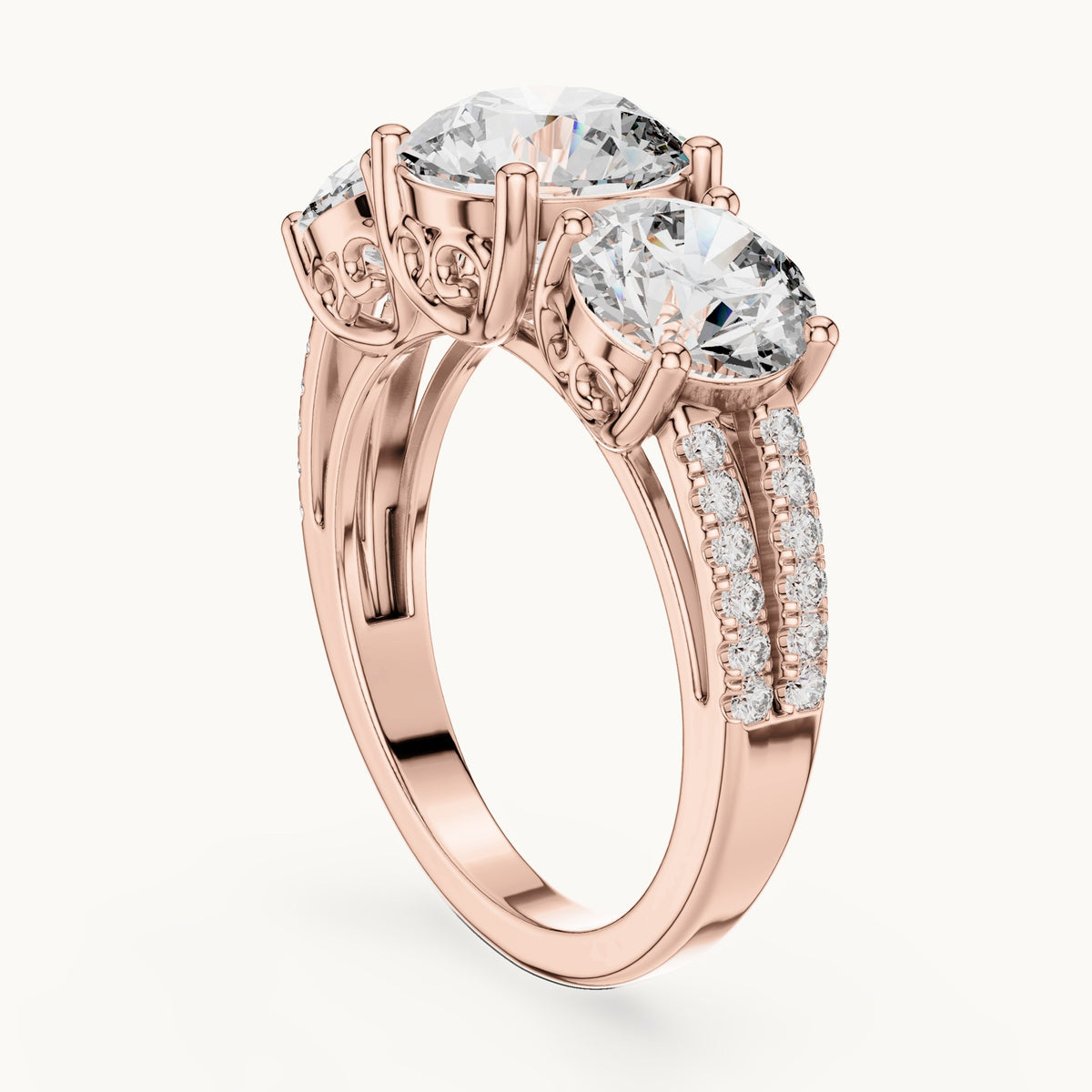 Round lab-grown diamond three-stone engagement ring with split pavé shank in rose gold, 4.192 CT TW, view 1