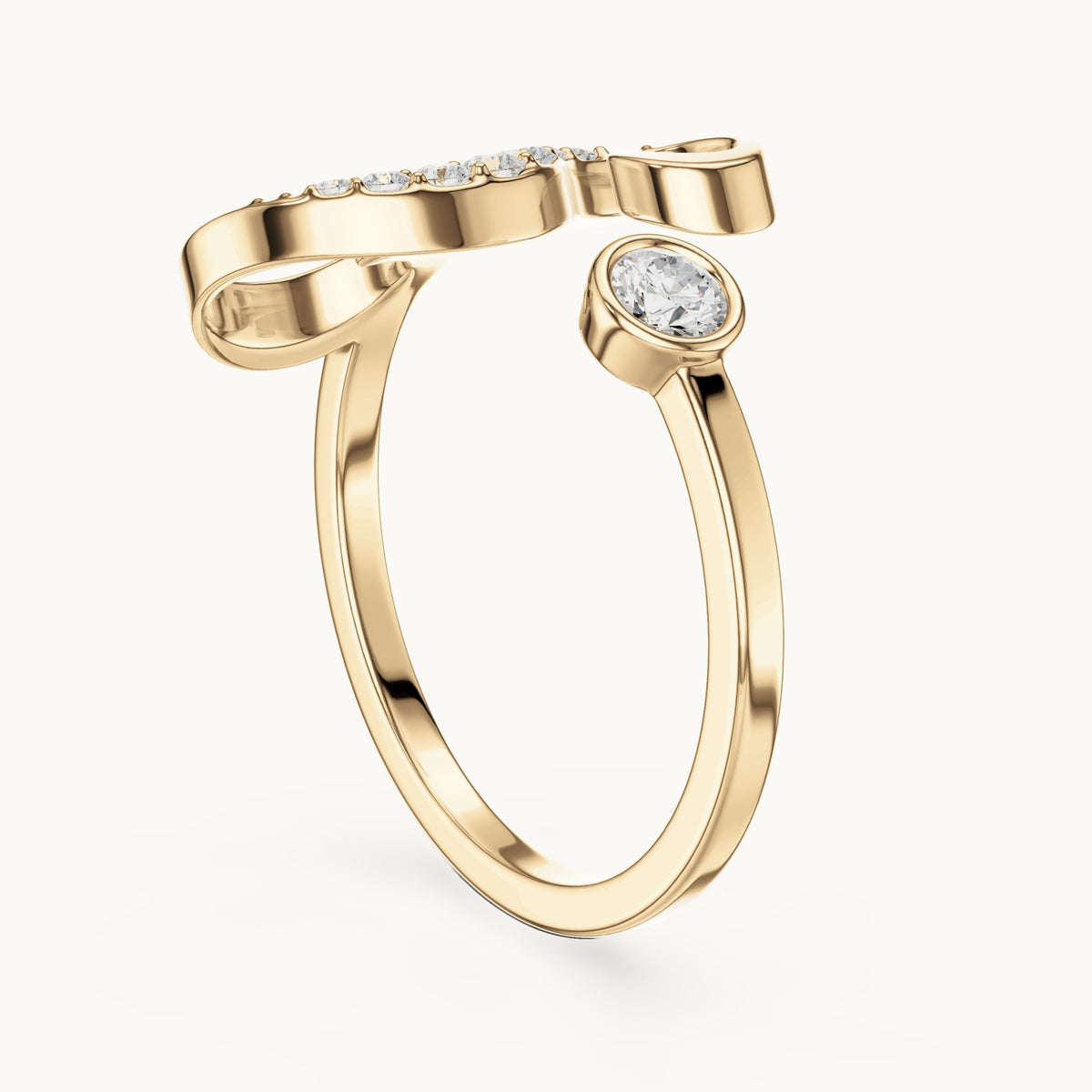 Round lab-grown diamond swirl bypass ring with bezel diamond in yellow gold, 0.228 CT TW, view 1
