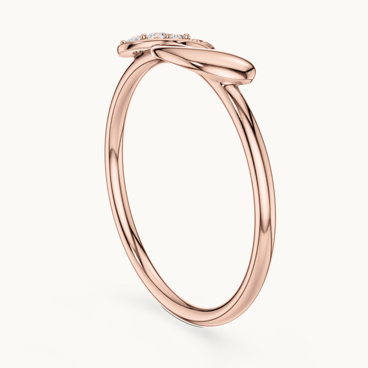Round lab-grown diamond twisted knot ring in rose gold, 0.039 CT TW, view 1
