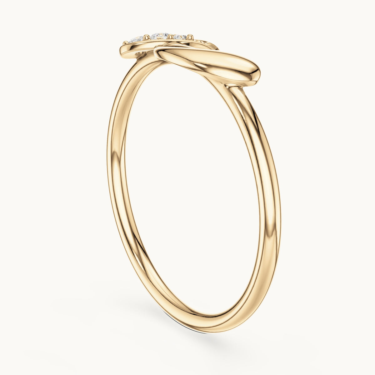 Round lab-grown diamond twisted knot ring in yellow gold, 0.039 CT TW, view 1