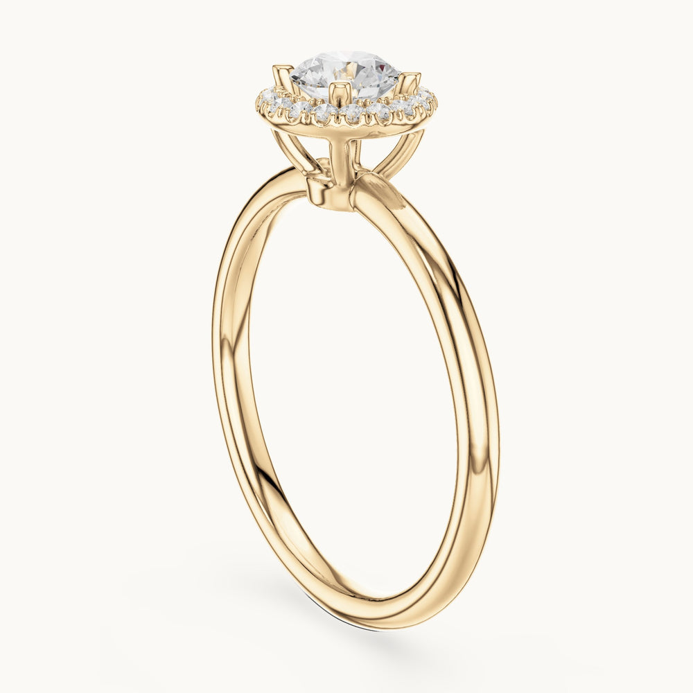 Round lab-grown diamond cathedral halo engagement ring in yellow gold, 0.58 CT TW, view 1