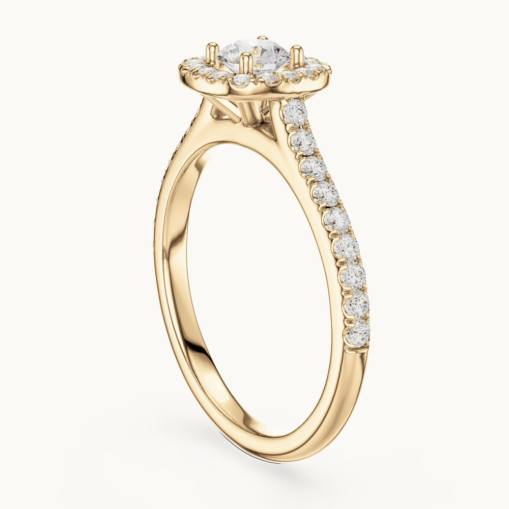 Round lab-grown diamond cushion-shaped halo engagement ring with pavé band in yellow gold, 0.81 CT TW, view 1