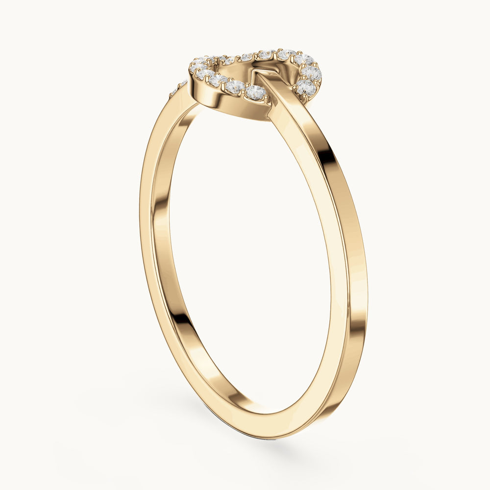 Round lab-grown diamond love knot pavé ring in yellow gold, 0.10 CT TW, view 1