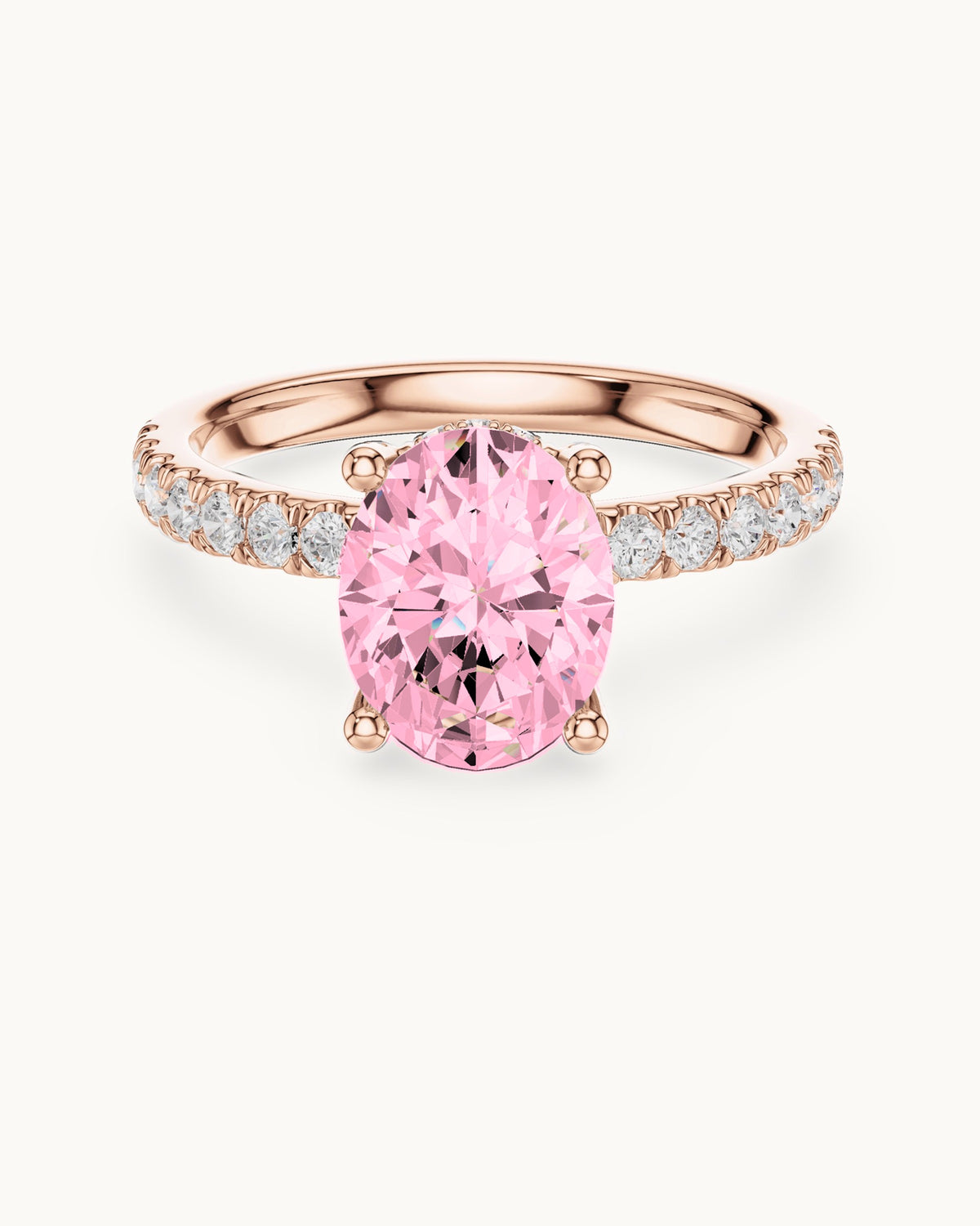 Ishira oval ring with pavé band in rose gold, shown with a pink center diamond (digitally colored render)