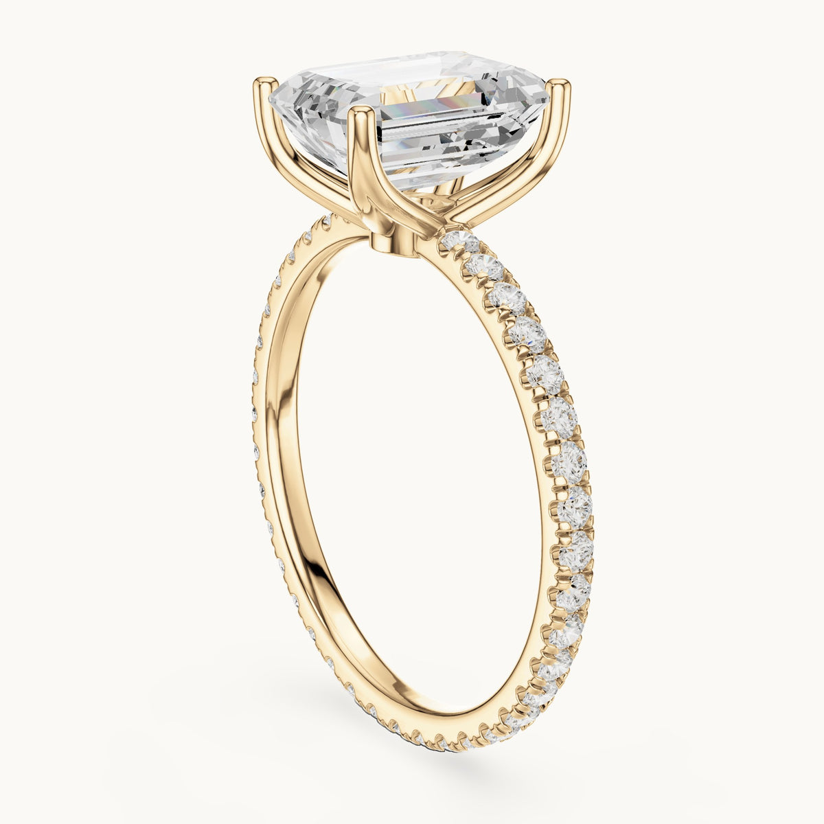 Emerald-cut lab-grown diamond pavé band solitaire engagement ring in yellow gold, 2.944 CT TW, view 1