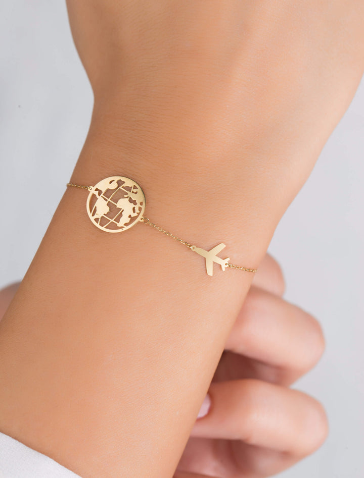 18K GOLD PLANE AND GLOBE BRACELET