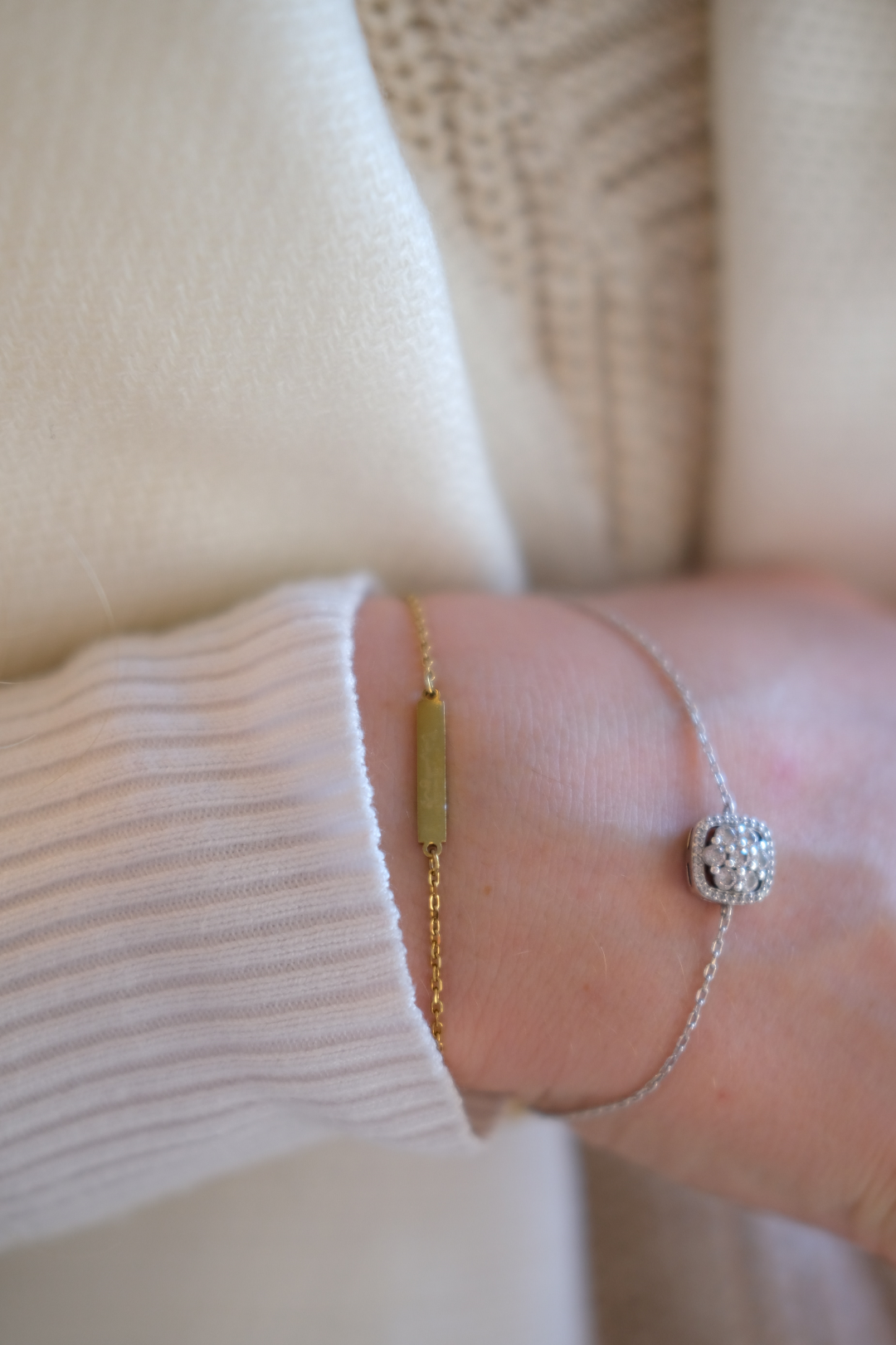 gold and diamond bracelets worn by a woman