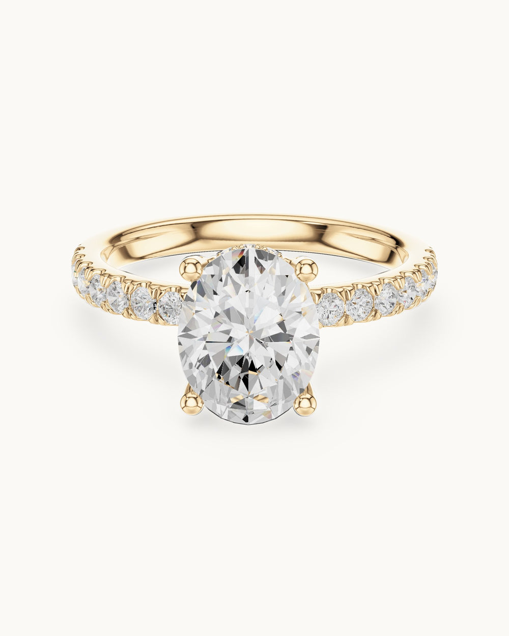 Oval lab-grown diamond engagement ring with pavé band in 14K yellow gold, front view