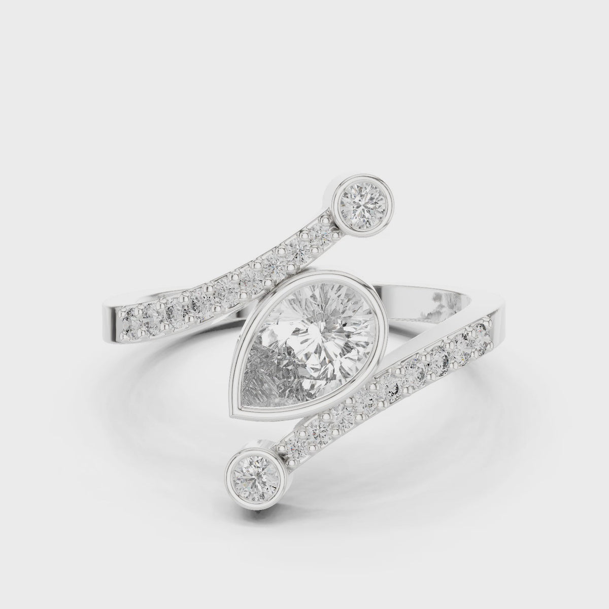Pear lab-grown diamond open bypass ring with bezel accents in white gold, 360 degree video