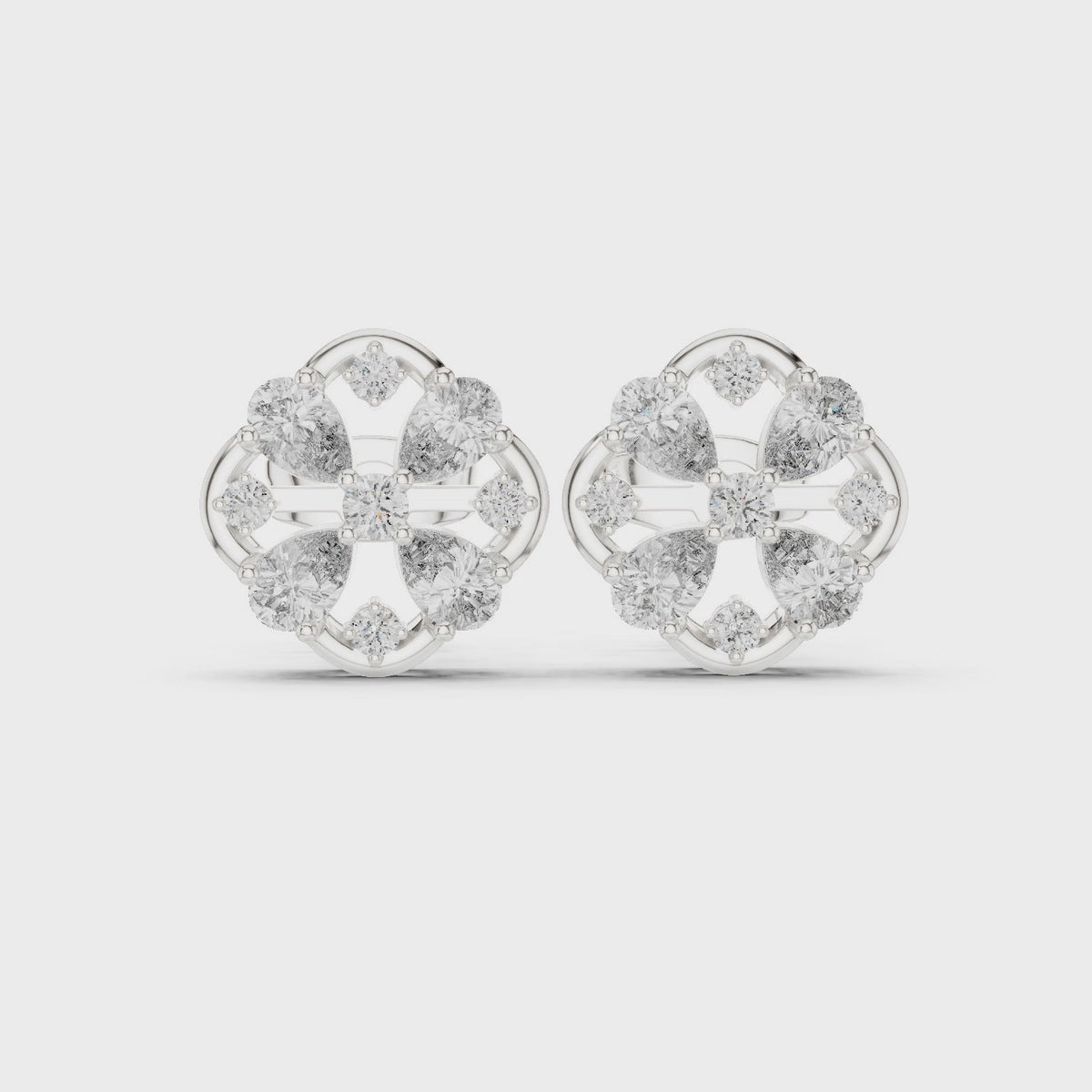 Pear and round lab-grown diamond clover stud earrings in white gold, 360 degree video