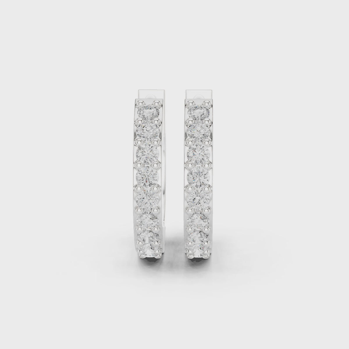Round lab-grown diamond huggie hoop earrings in white gold, 360 degree video