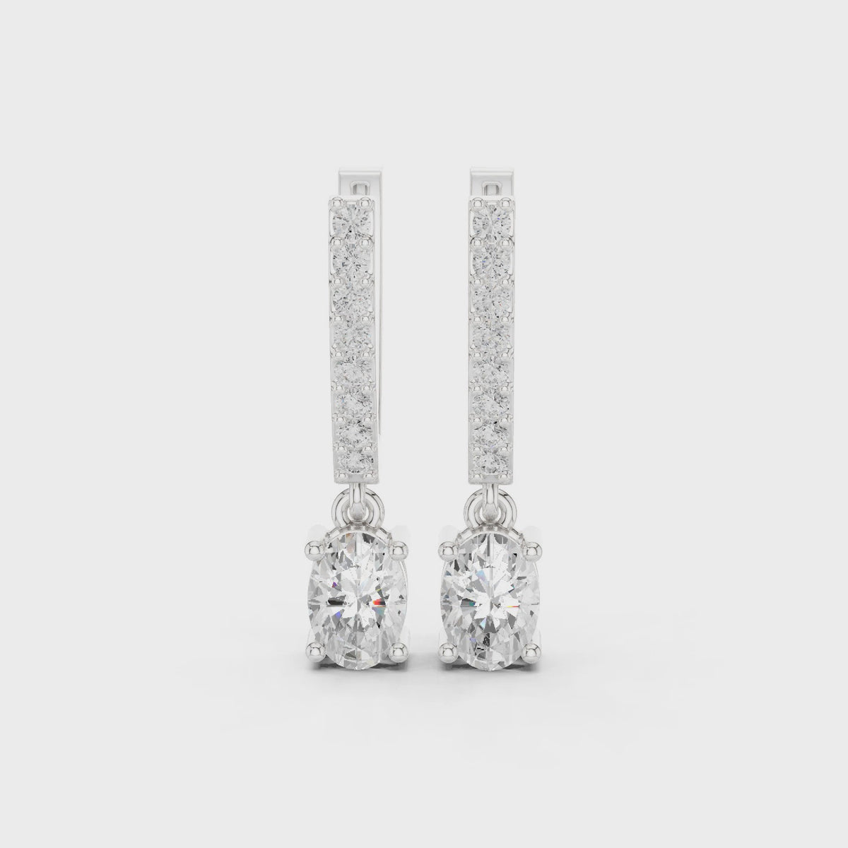 Oval and round lab-grown diamond huggie drop earrings in white gold, 360 degree video