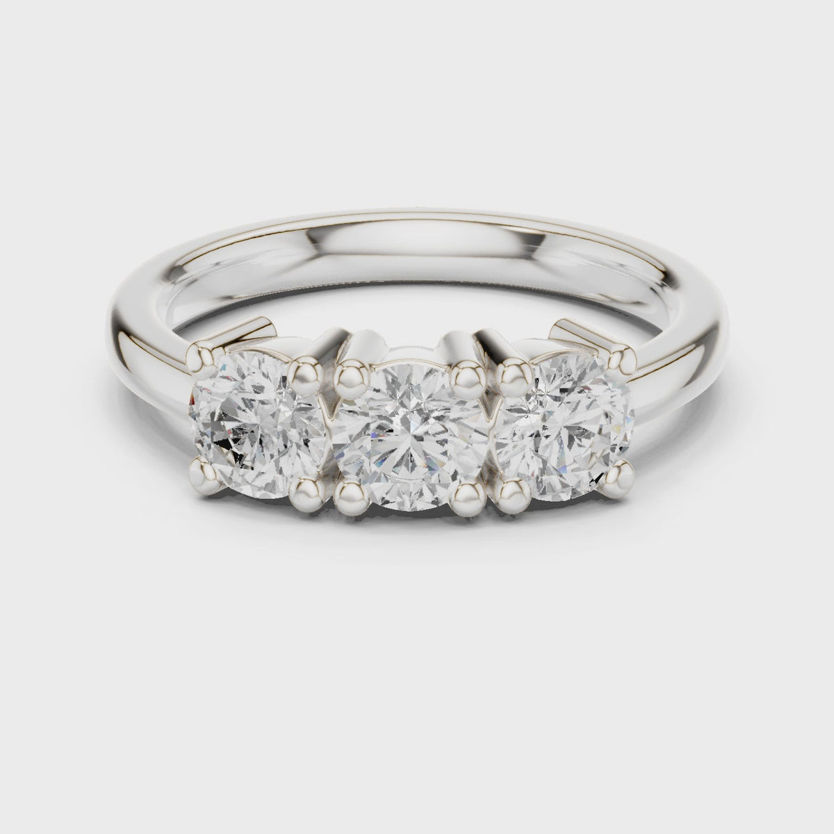 Round lab-grown diamond three stone ring in white gold, 360 degree video
