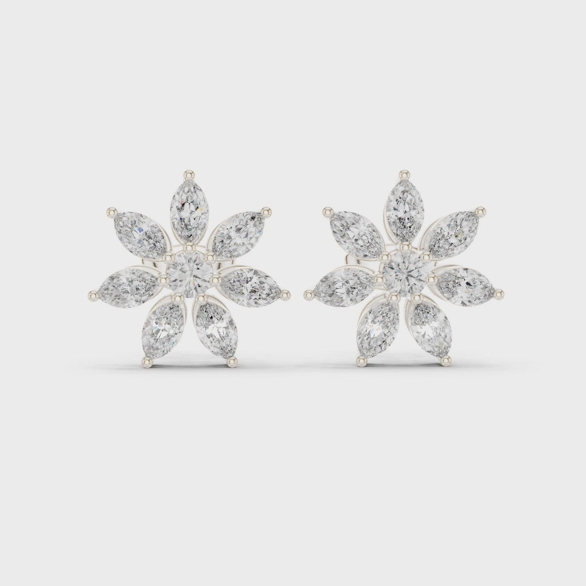 Marquise and round lab-grown diamond flower stud earrings in white gold, 360 degree video