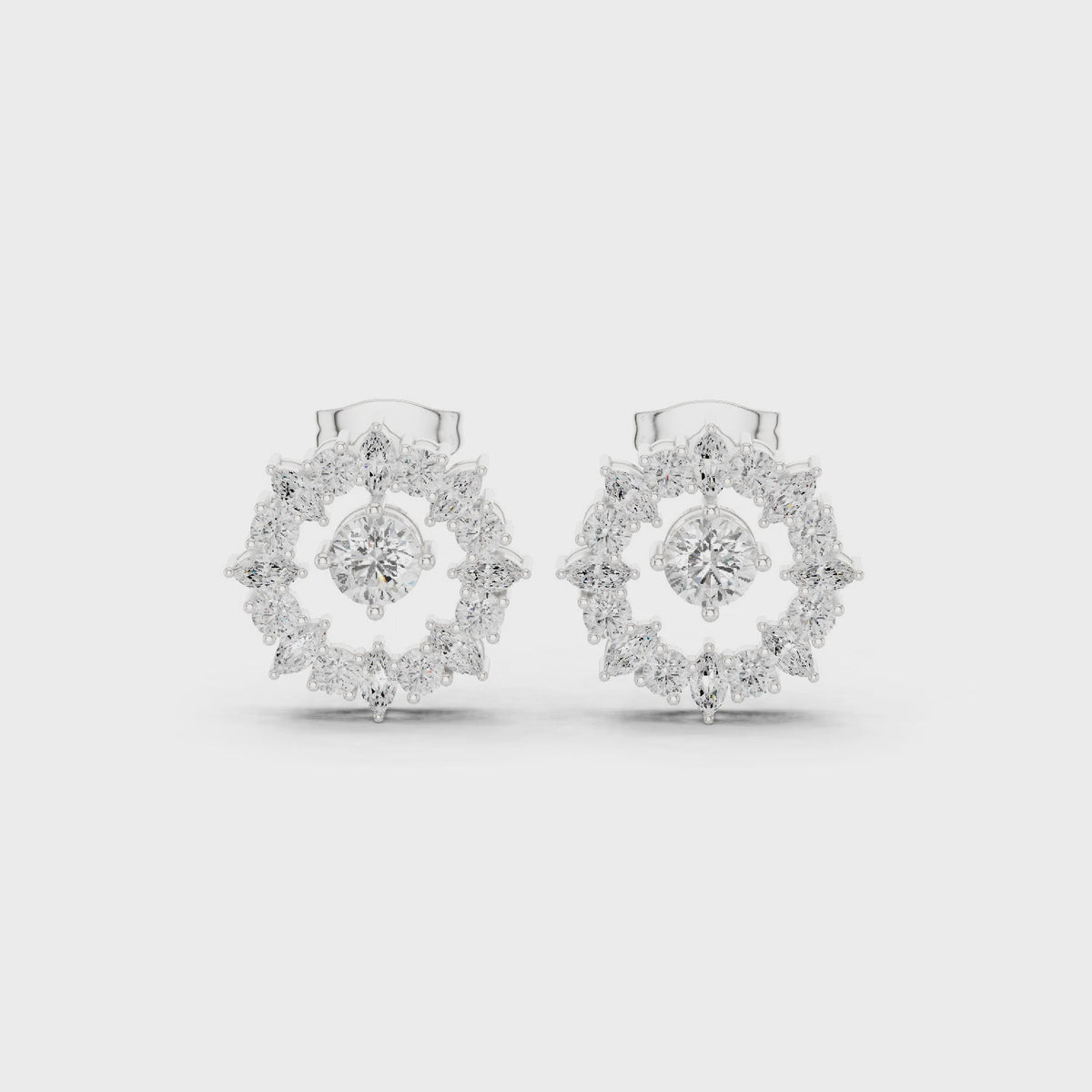 Round and marquise lab-grown diamond starburst halo stud earrings in white gold, 360 degree video