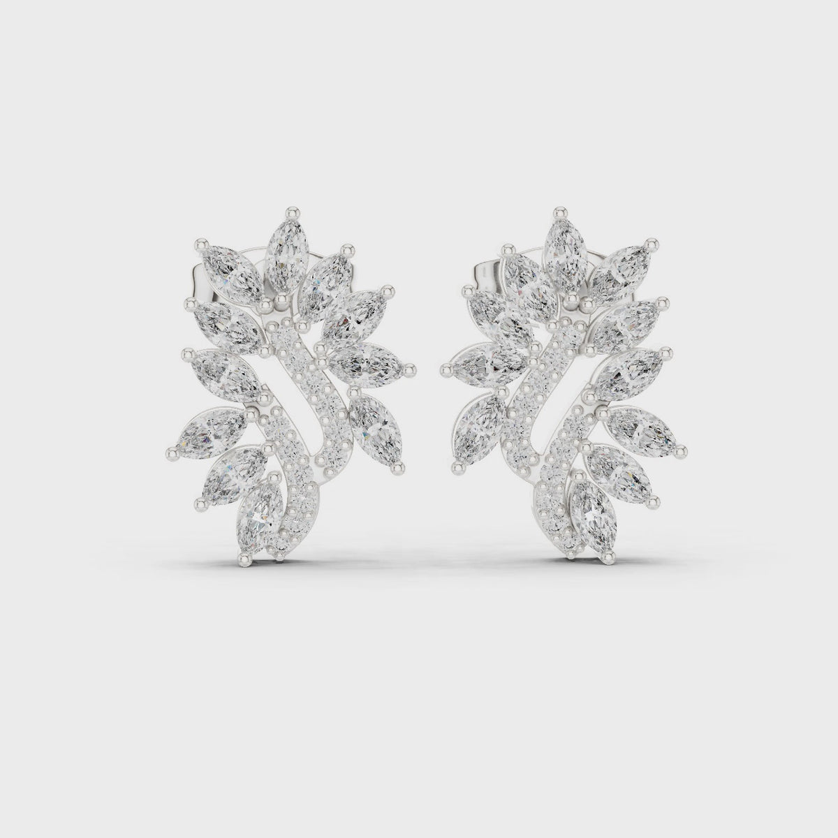 Marquise and round lab-grown diamond leaf cluster stud earrings in white gold, 360 degree video