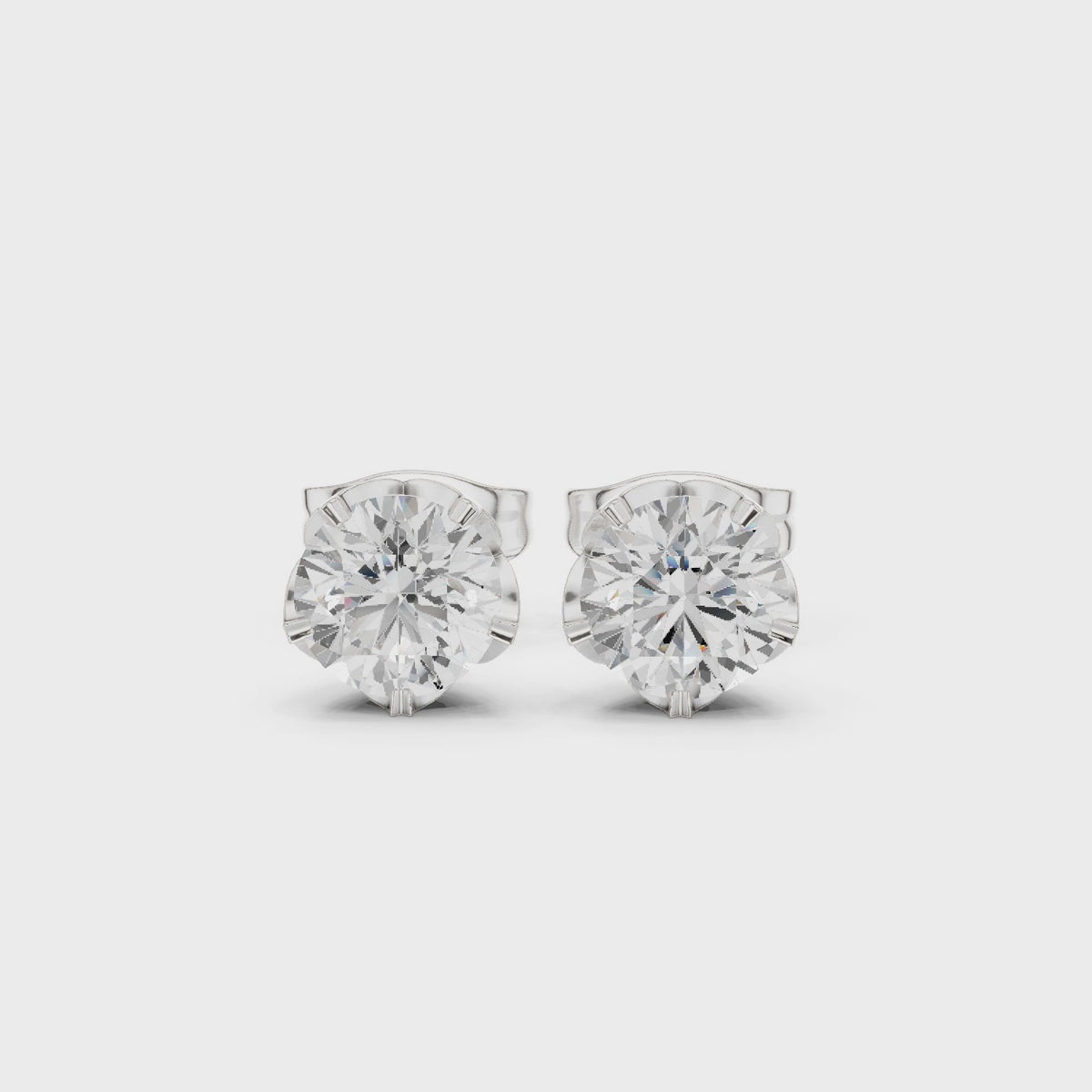 Round lab-grown diamond solitaire stud earrings in white gold, 360 degree video