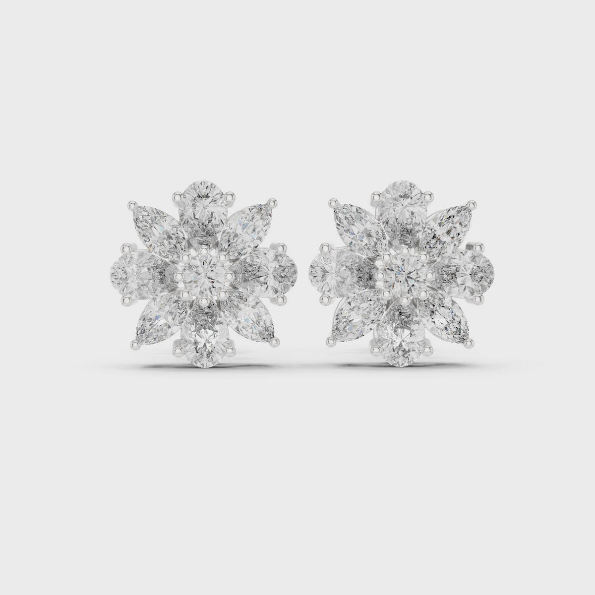 Pear, marquise and round lab-grown diamond flower cluster stud earrings in white gold, 360 degree video