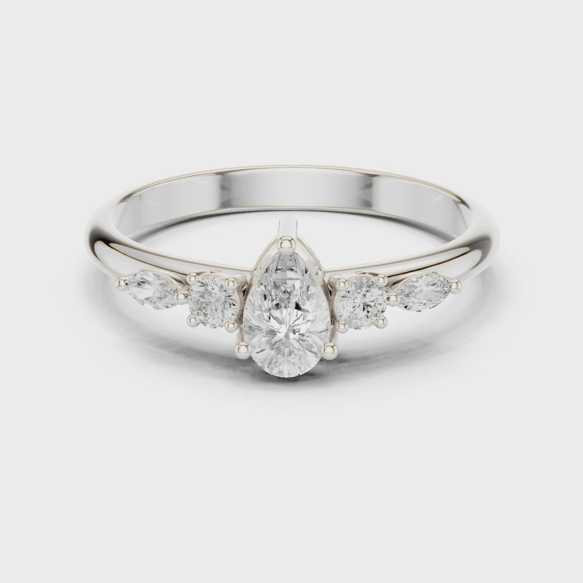 Pear lab-grown diamond engagement ring with marquise and round side stones in white gold, 360 degree video