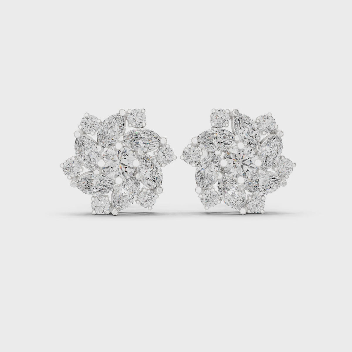 Marquise and round lab-grown diamond floral halo stud earrings in white gold, 360 degree video