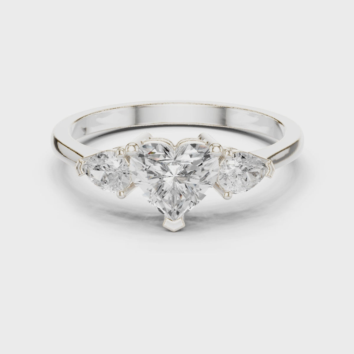 Heart lab-grown diamond three stone engagement ring in white gold, 360 degree video