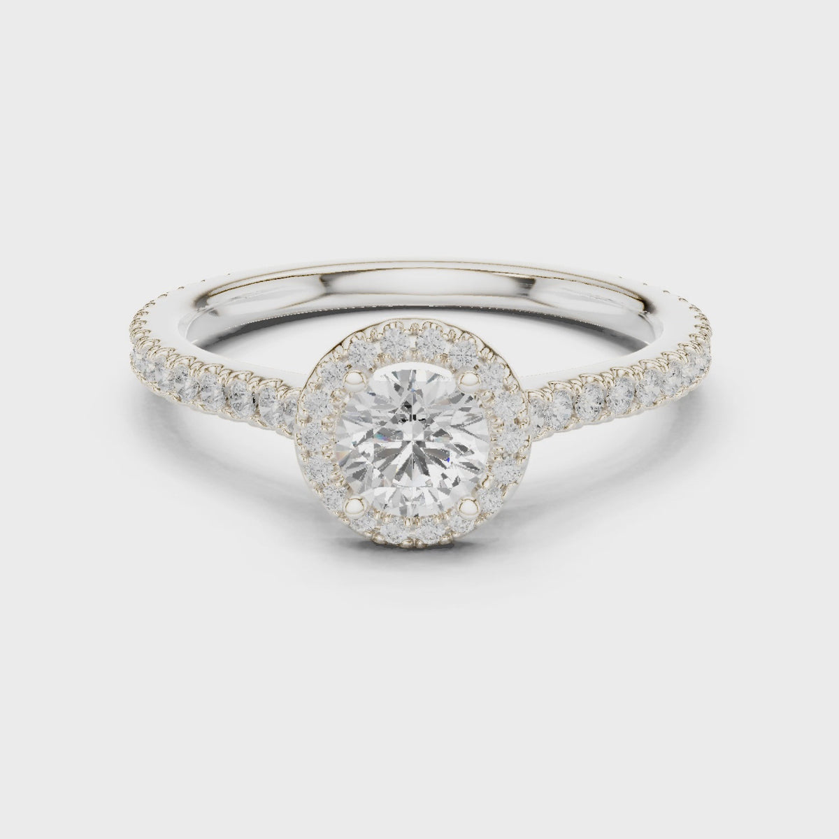 Round lab-grown diamond halo engagement ring with pavé band in white gold, 360 degree video