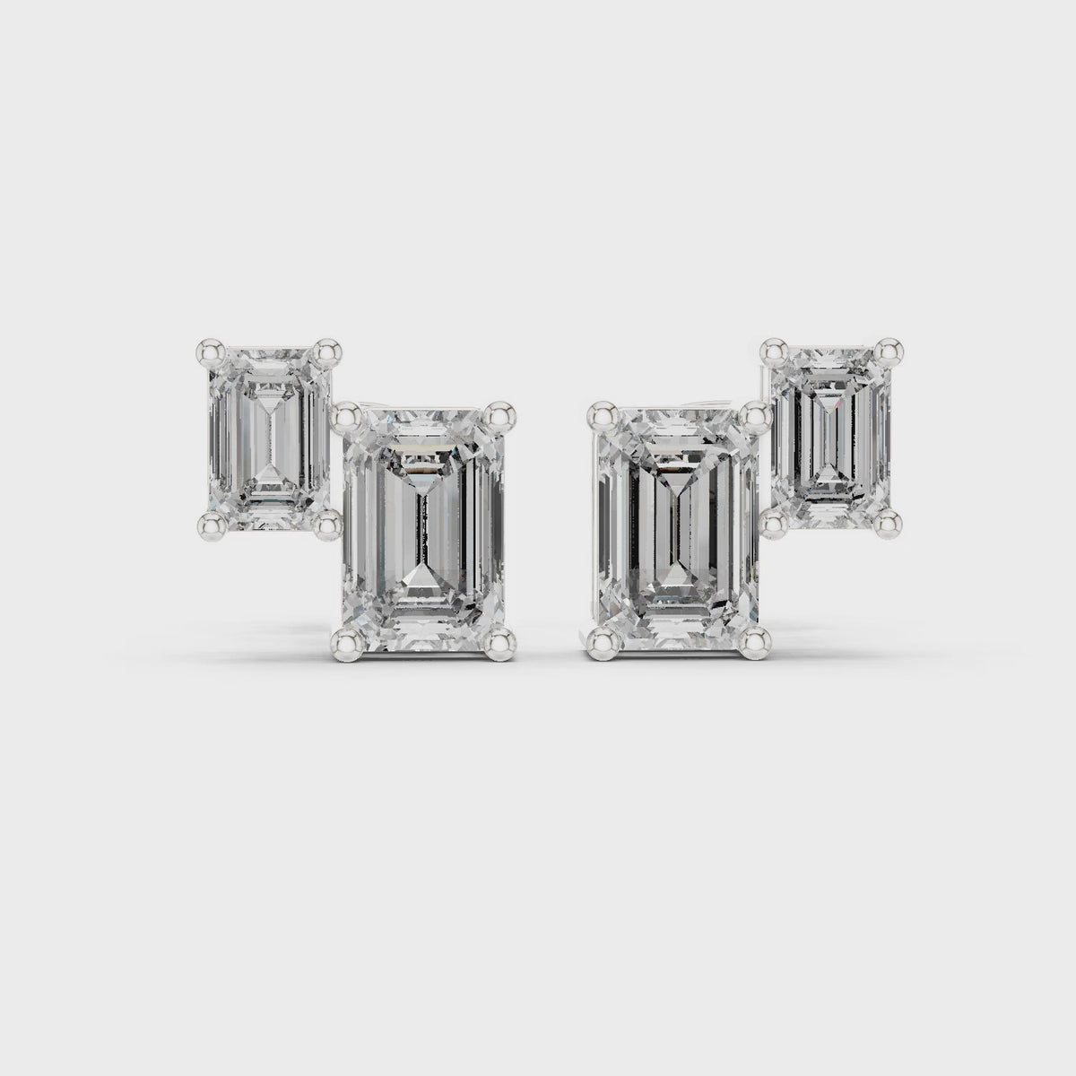 Emerald-cut lab-grown diamond two stone stud earrings in white gold, 360 degree video