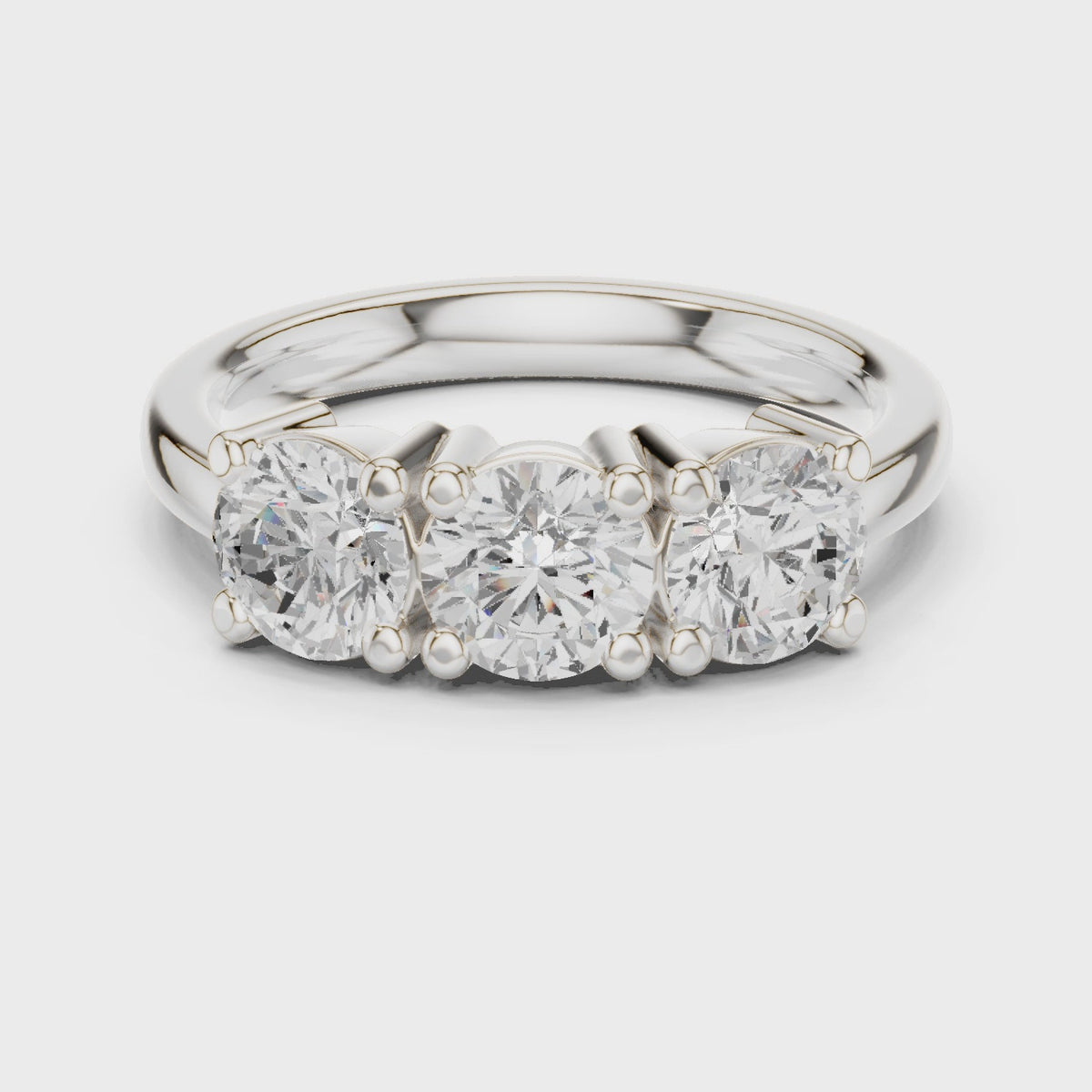 Round lab-grown diamond three stone ring in white gold, 360 degree video
