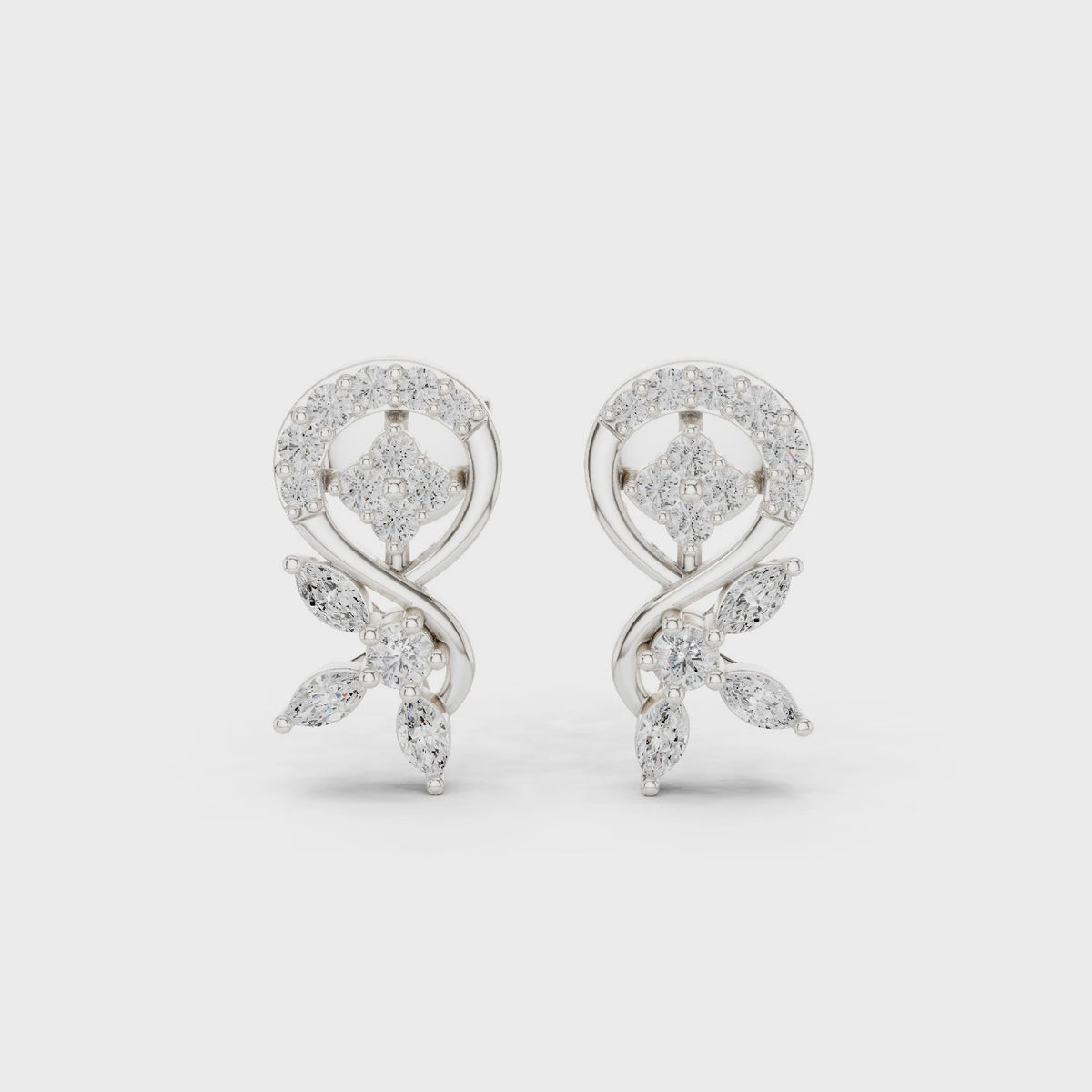 Round and marquise lab-grown diamond swirl stud earrings in white gold, 360 degree video