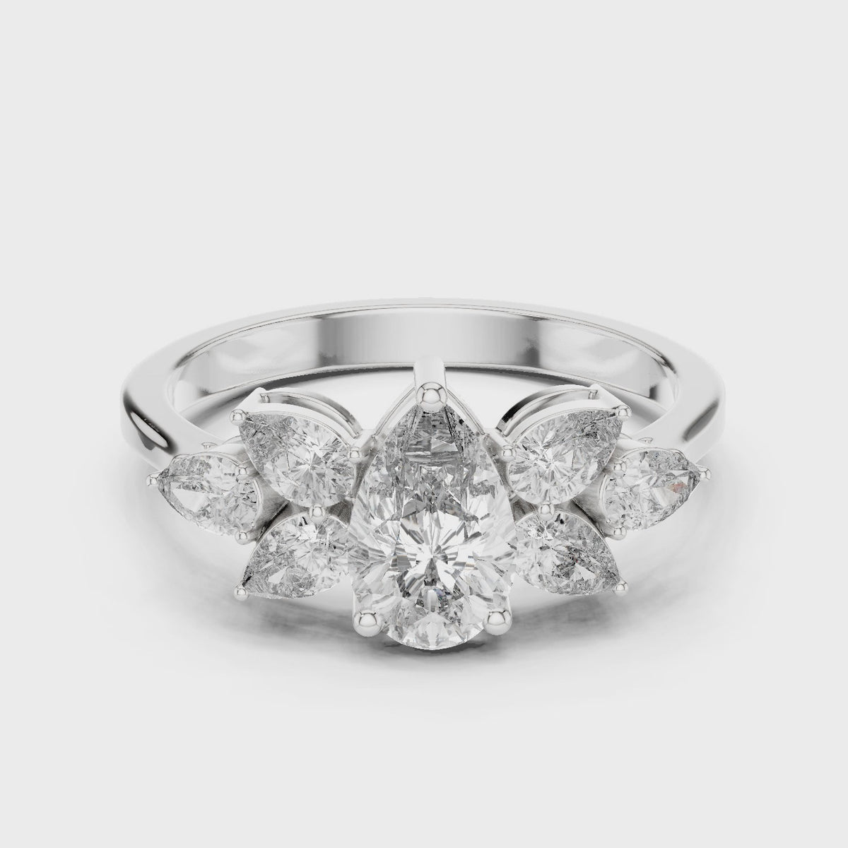 Pear lab-grown diamond petal cluster engagement ring in white gold, 360 degree video