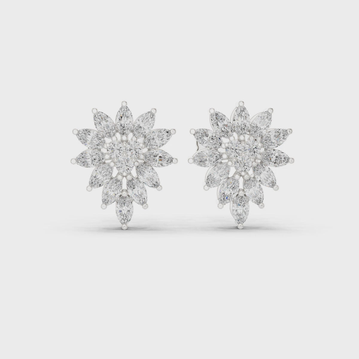 Marquise and round lab-grown diamond cluster stud earrings in white gold, 360 degree video